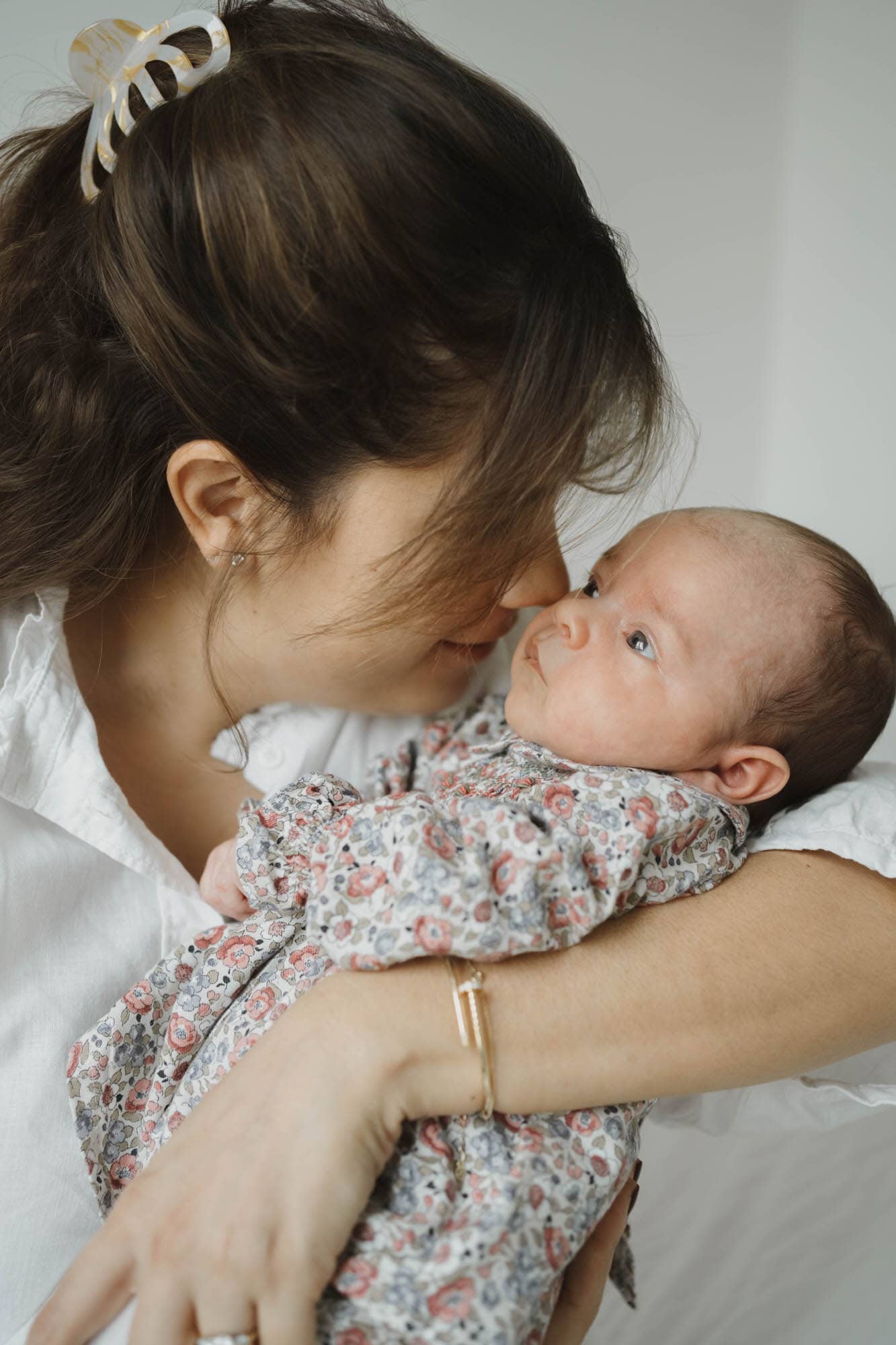 london newborn photography of mother holding her newborn daughter