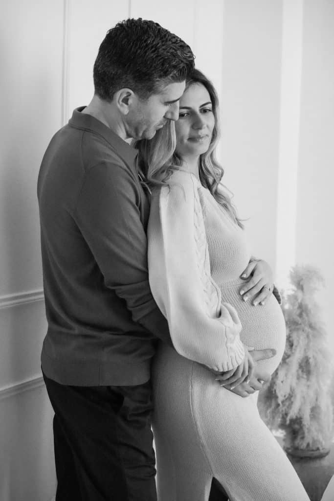 pregnant woman and her husband in image taken by london pregnancy photographer