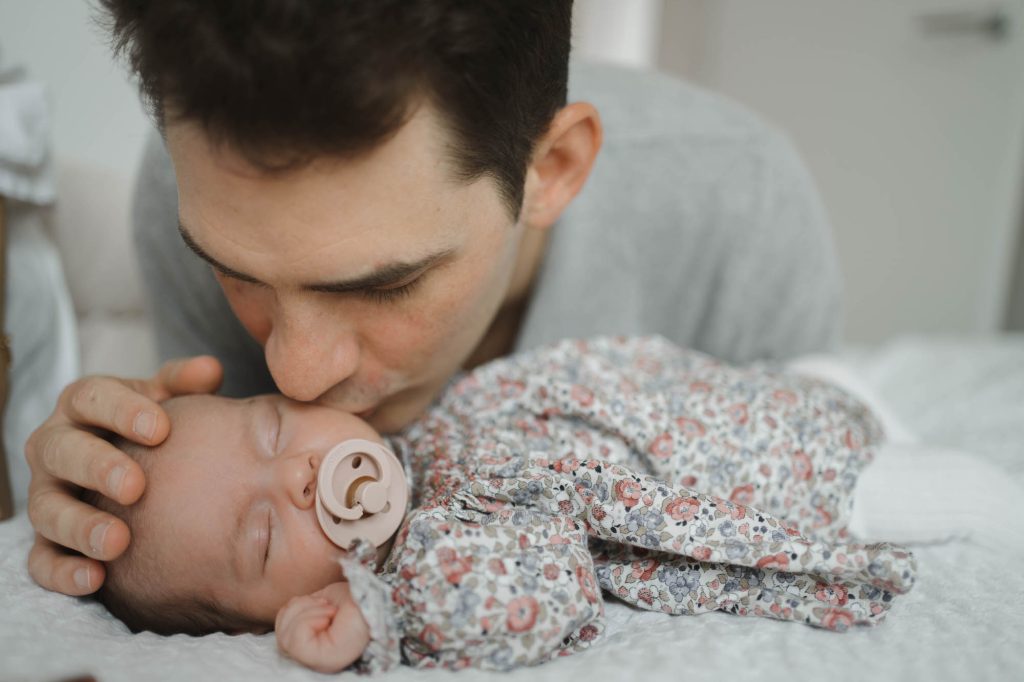 Father kissing baby, example of london baby photography