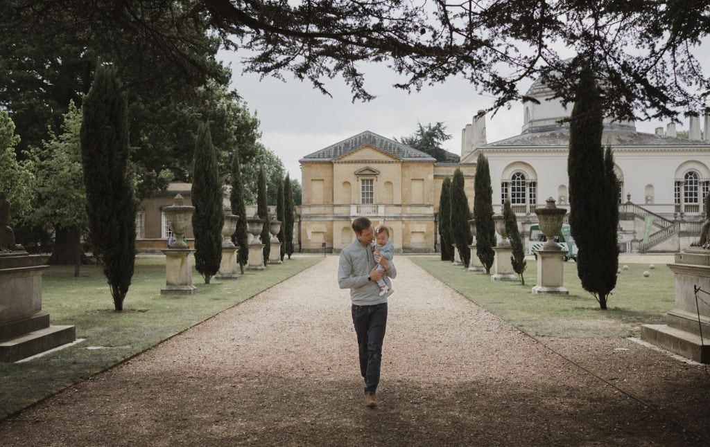 father and daughter walking at chiswick house in photo taken by west london family photographer